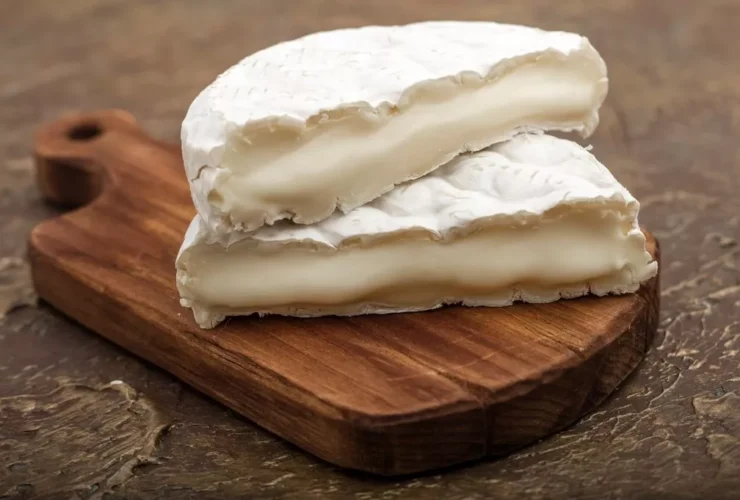0 soft cheese with white mold on a cutting board with vegetables 3